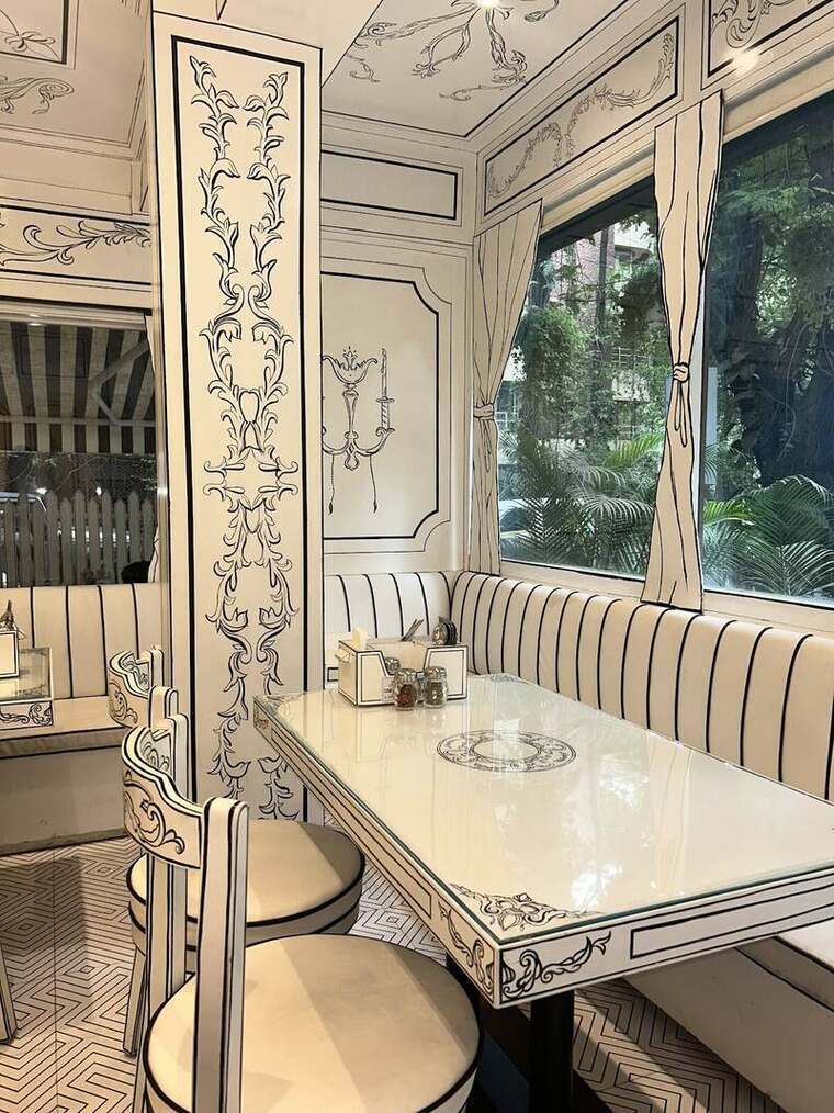 Corner booth with drawn column, striped banquette and herringbone floor